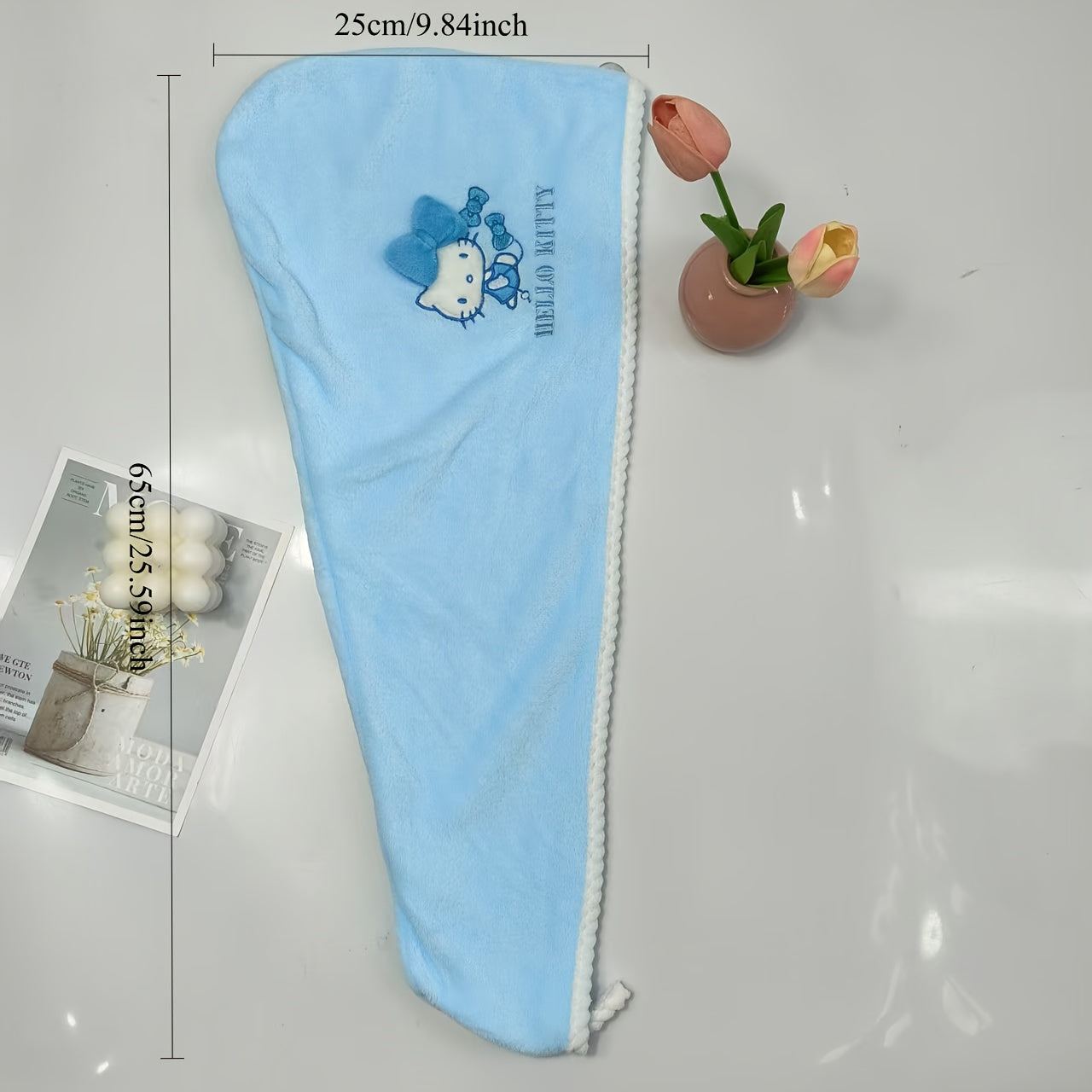 A Set of Three Sanrio Towels Themed Around for Hello Kitty, Including Bath Towels, Face Towels, And a Hair Drying Cap, All Showcasing a Three-Dimensional for Hello Kitty Design